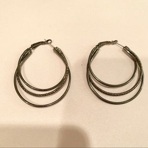 Gray metal hoop earrings.